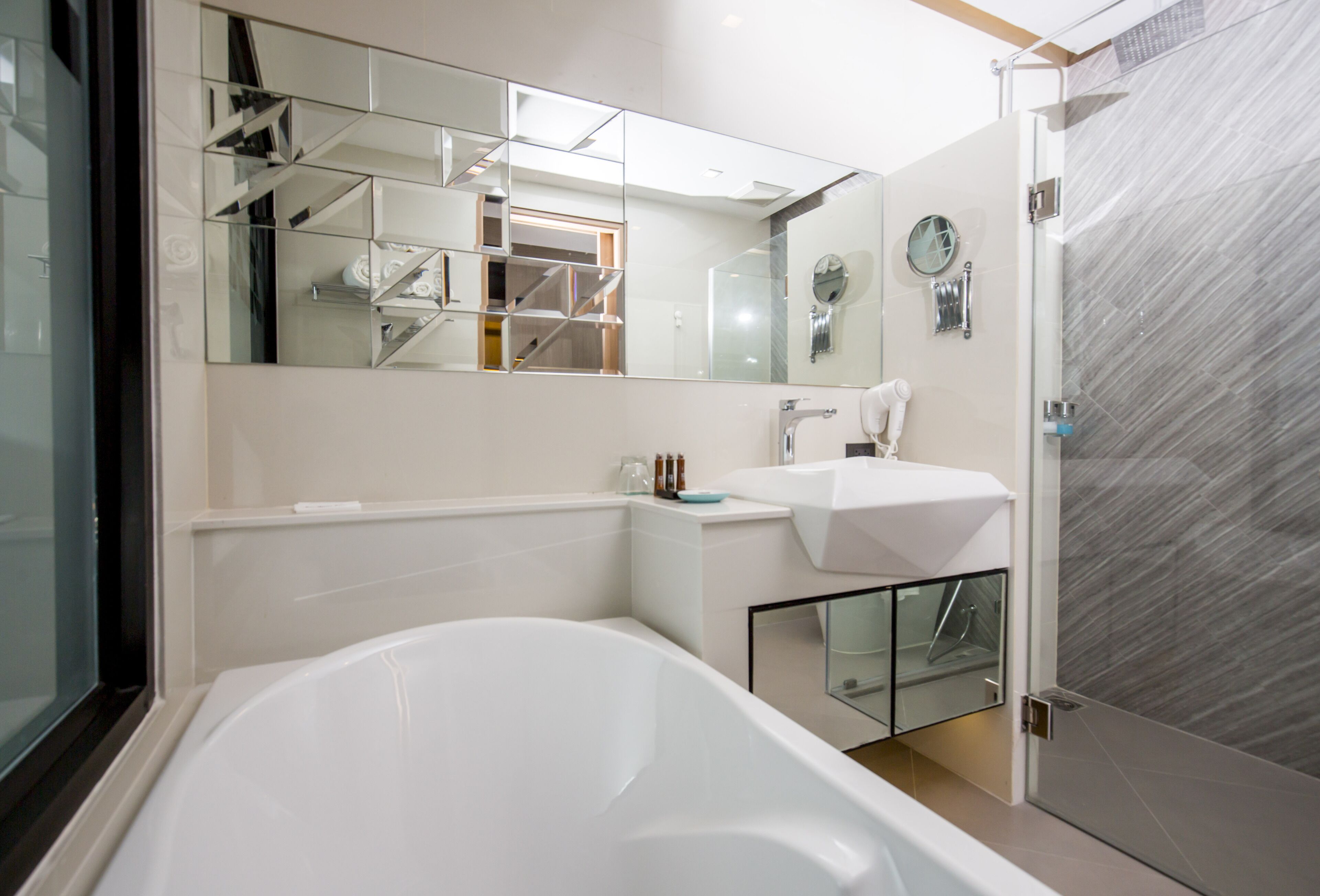 family room | 1 bedroom, minibar, in-room safe, desk