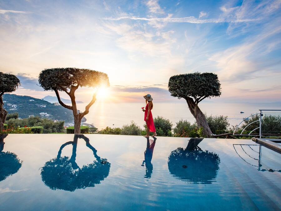 Seasonal outdoor pool, open 9 AM to 7 PM, pool umbrellas, pool loungers