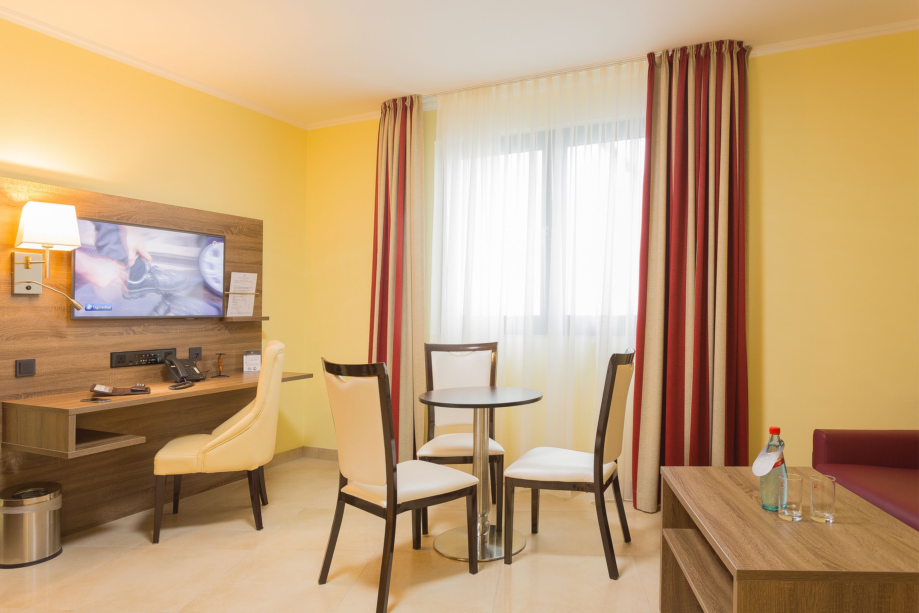junior suite | living area | flat-screen tv, heated floors