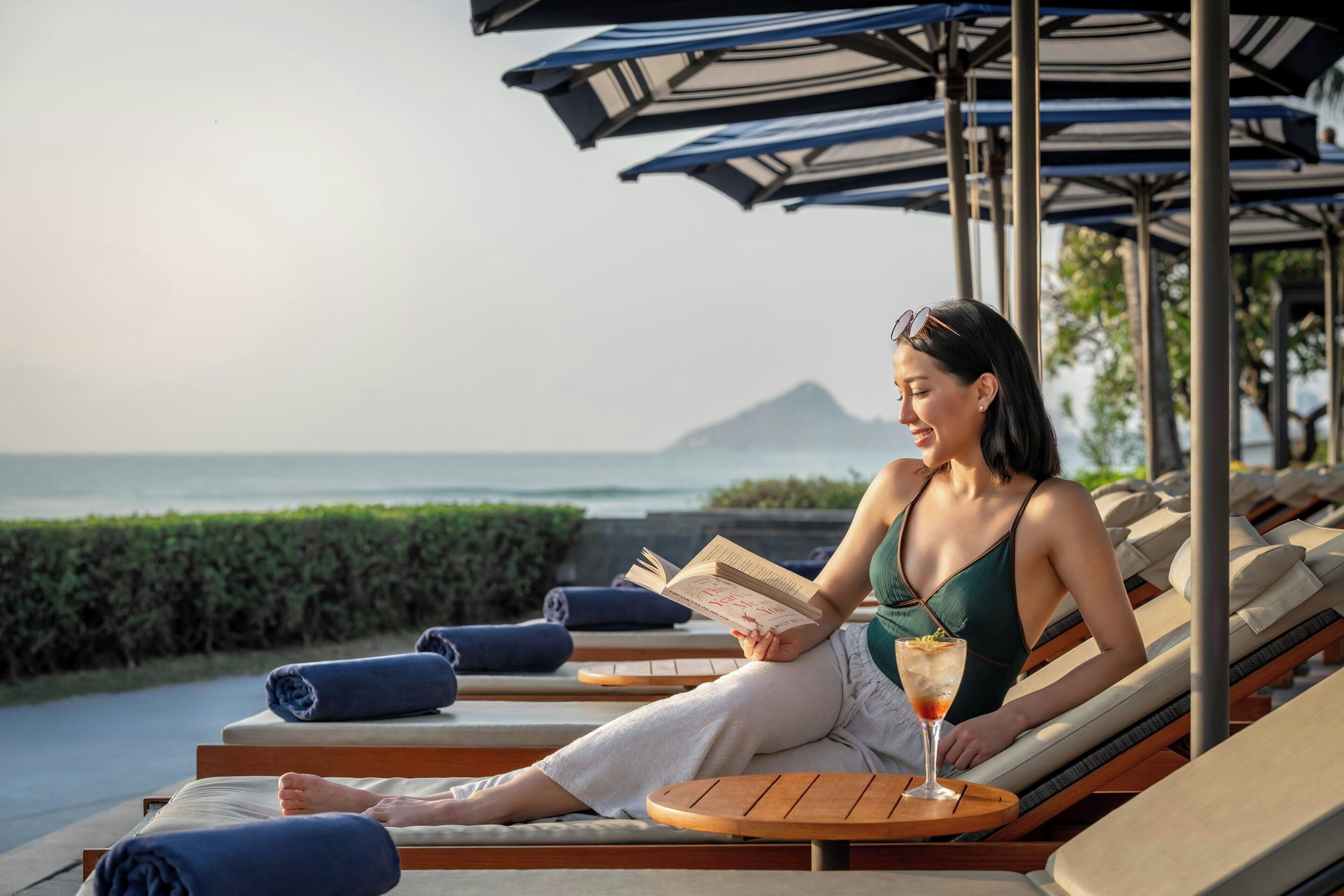 On the beach, sun-loungers