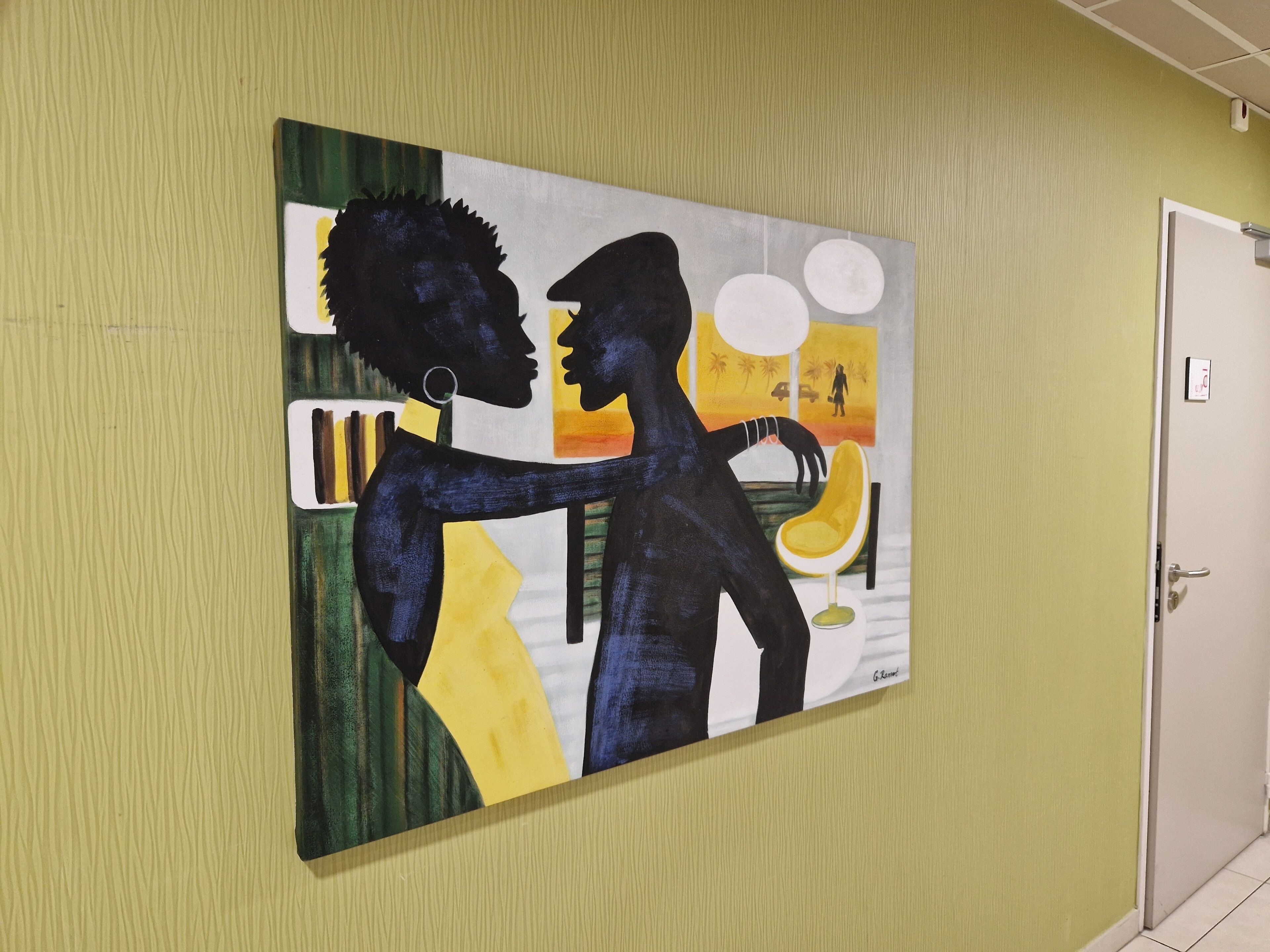 A painting on a yellow wall, a door, and a light switch.