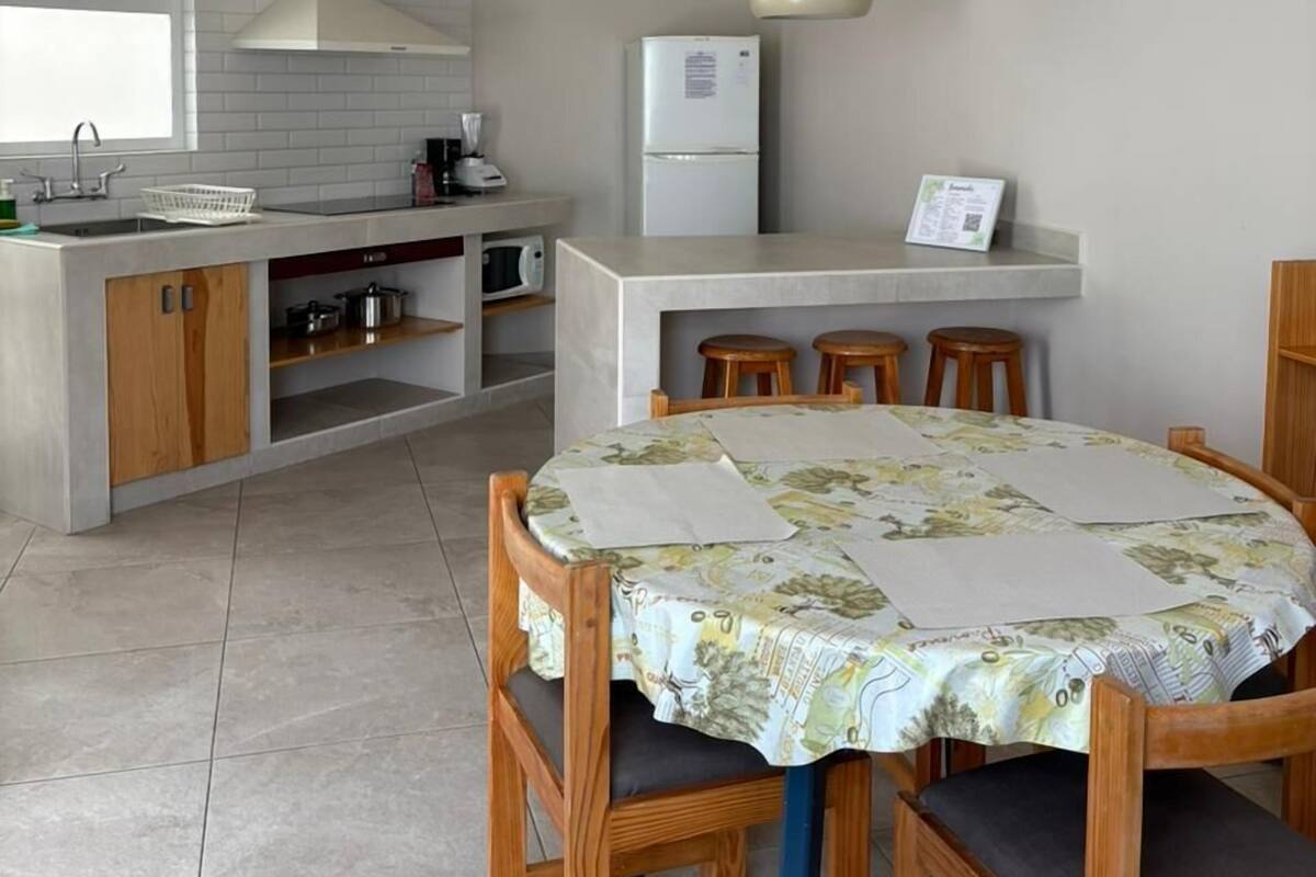 A modern kitchen with a dining area.