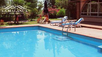 Outdoor pool, a natural pool, sun loungers