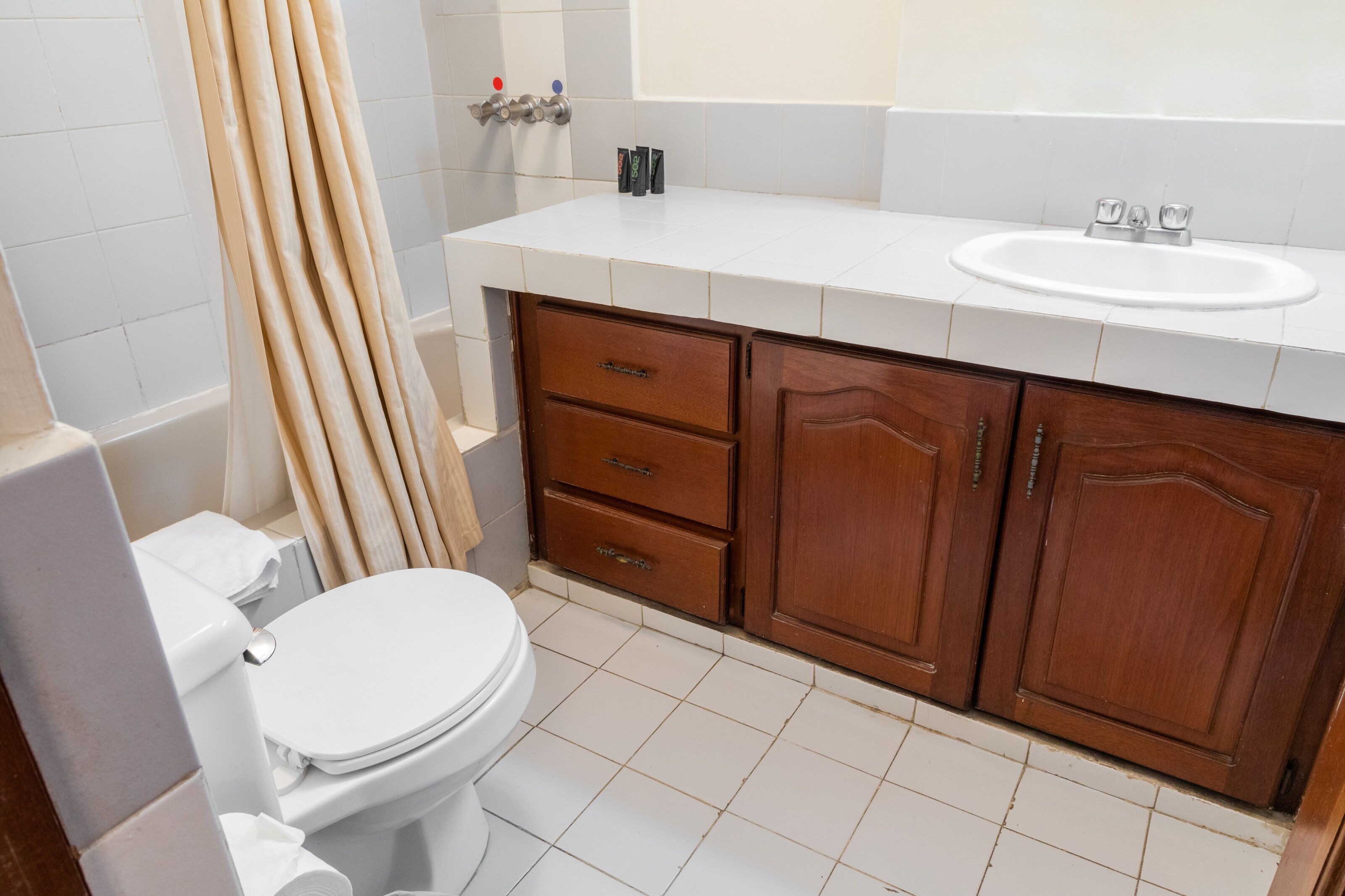 double room, garden view, courtyard area | bathroom | shower, free toiletries, hair dryer, towels