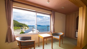 A room with tatami flooring, a wooden table, two chairs, a large window with a view of a bridge and hills, and a wardrobe. - Naruto Kaigetsu Bettei Taimaru Kaigetsu (Naruto)