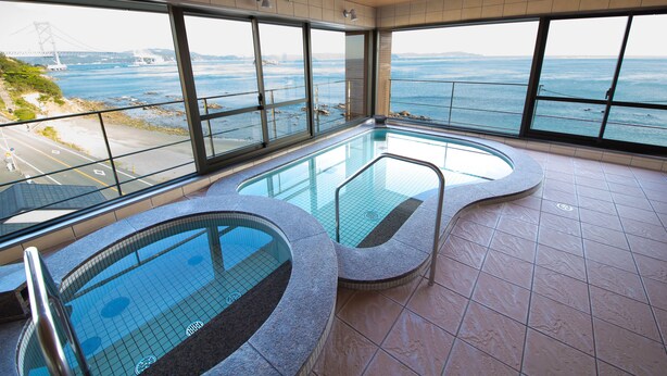 An indoor swimming pool with a view of the ocean and a bridge. - Naruto Kaigetsu Bettei Taimaru Kaigetsu (Naruto)