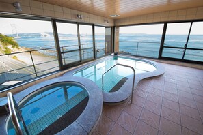 An indoor swimming pool with a view of the ocean and a bridge. - Naruto Kaigetsu Bettei Taimaru Kaigetsu (Naruto)