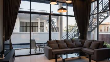 Family Villa | Living area | 55-inch Smart TV with cable channels, TV