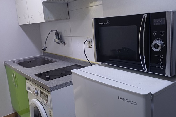 Classic Room, Kitchenette | Private kitchen | Fridge, cleaning supplies