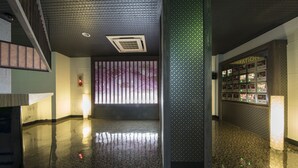A spacious lobby with a polished floor, a patterned wall, and a section labeled "Information". - Hotel Wacha Wacha - Adults Only (Kyoto)