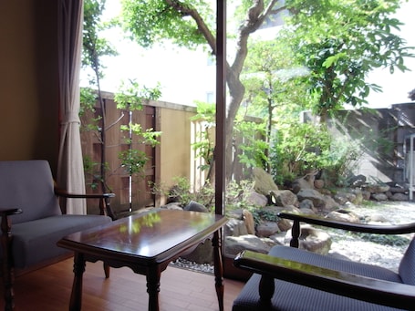 Superior Room, Private Bathroom | Living area | TV