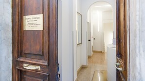A wooden door with a plaque for Domus Terenzio Guest House Roma. - Domus Terenzio (Rome)
