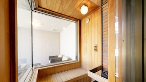 A sauna room with wooden benches and a large window. - Hotel Lotus Sakai - Adults Only (Sakai)