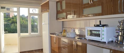 Apartment | Private kitchen | Full-sized fridge, microwave, stovetop, dishwasher
