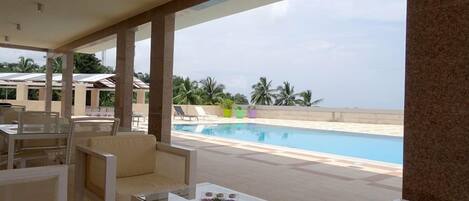 Outdoor pool, pool umbrellas, sun loungers