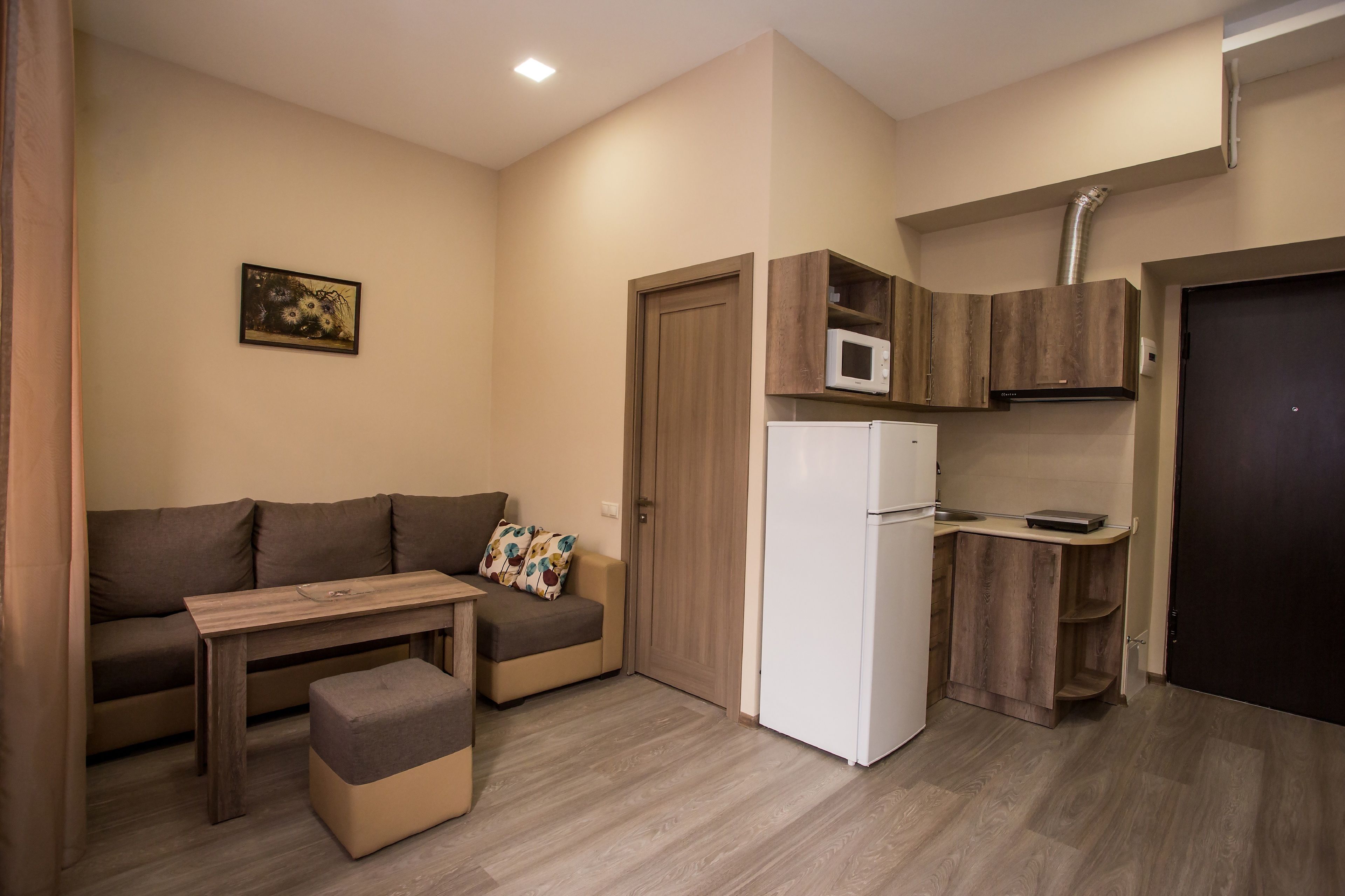 comfort apartment, 1 double bed | living area | flat-screen tv