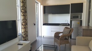 Sala Villas | Área de sala de estar | Televisión de pantalla plana 