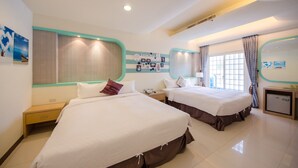 A hotel room with two beds, a small desk, a nightstand, a mini-fridge, and a large window with curtains. - Love Jane B&B (Hengchun)