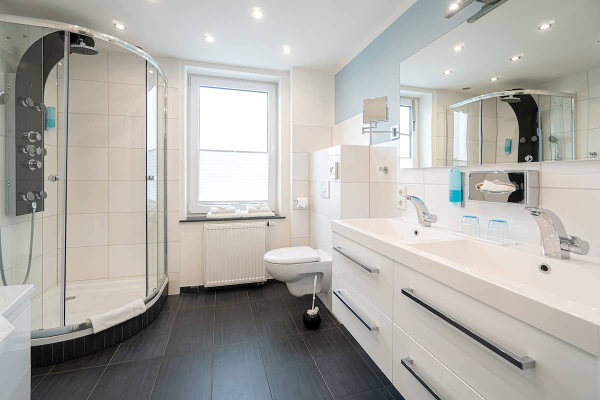 superior triple room | bathroom | shower, hair dryer, towels, toilet paper