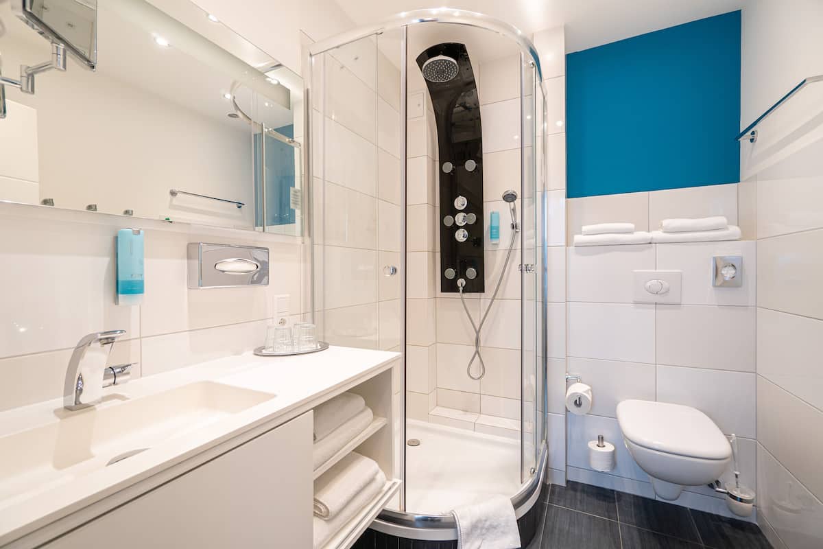 family room | bathroom | shower, hair dryer, towels, toilet paper