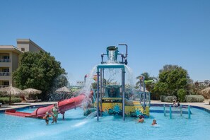 A water park with a central water feature, slides, and a swimming pool. - Sindbad Club (Hurghada)