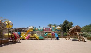 A playground with various play structures including slides and climbing areas. - Sindbad Club (Hurghada)