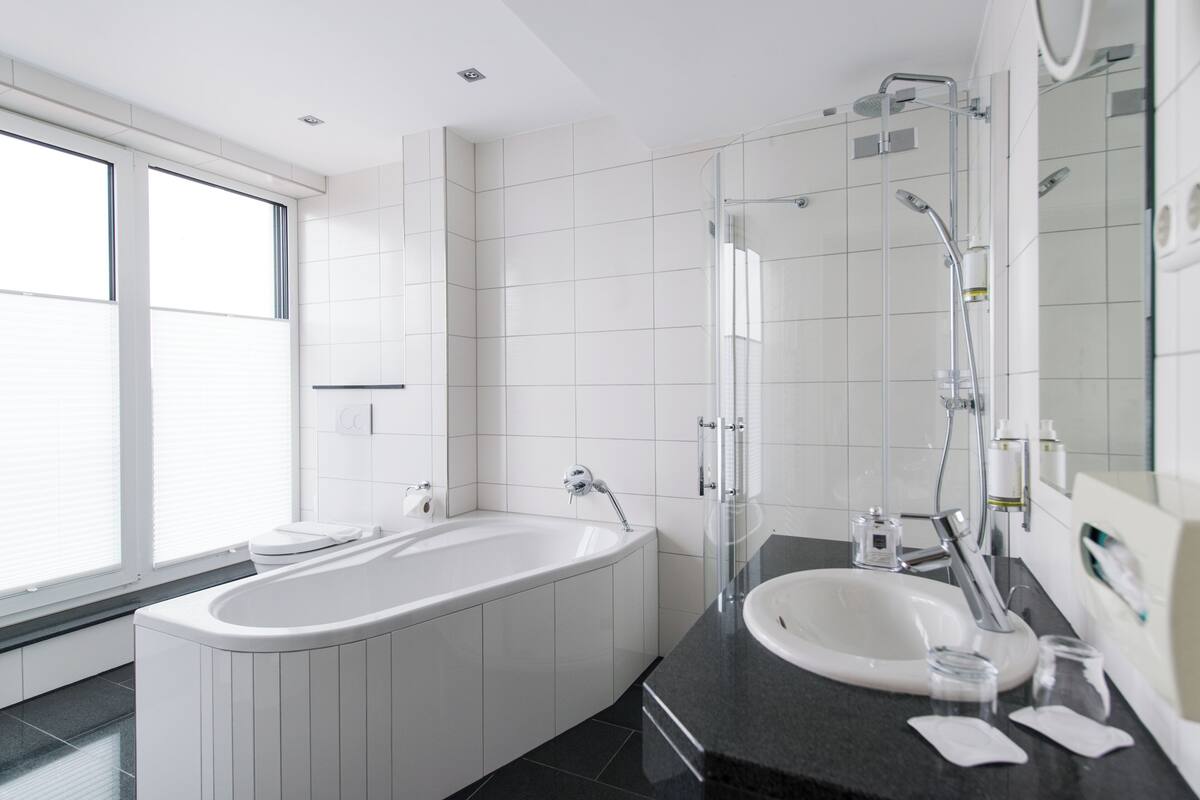 superior double room | bathroom | shower, free toiletries, hair dryer, towels