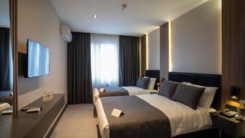 Standard Triple Room | Premium bedding, minibar, in-room safe, iron/ironing board