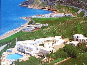 A coastal resort with multiple buildings, a swimming pool, and a beach. - Scaleta Beach (Rethymno)