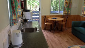 Standard Villa | Living area | 32-inch flat-screen TV with cable channels, TV, ping pong