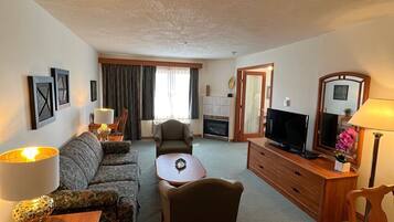 Suite, 1 King Bed with Sofa bed (Maple) | Living area | Flat-screen TV