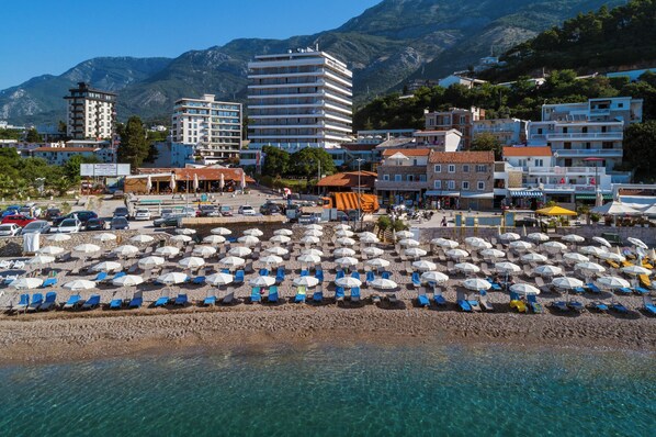 Private beach, white sand, sun-loungers, beach umbrellas