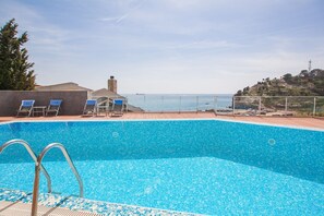 Outdoor pool, pool umbrellas, pool loungers