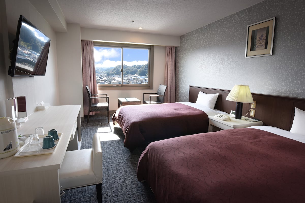 Standaard Twin kamer, uitzicht op rivier | Luxe beddengoed, een bureau, gratis wifi, beddengoed