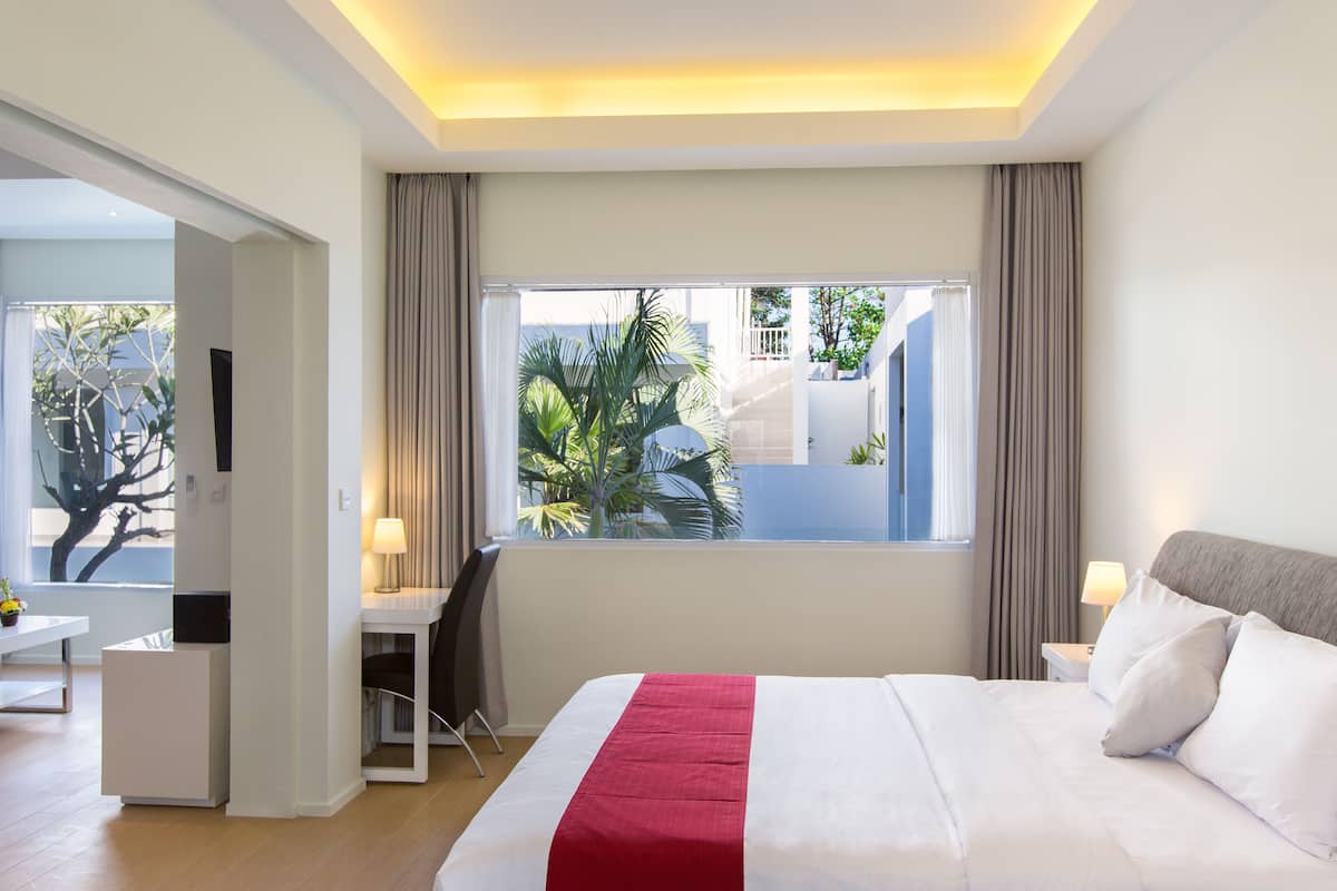Deluxe Room, Pool View | 1 bedroom, premium bedding, in-room safe, desk