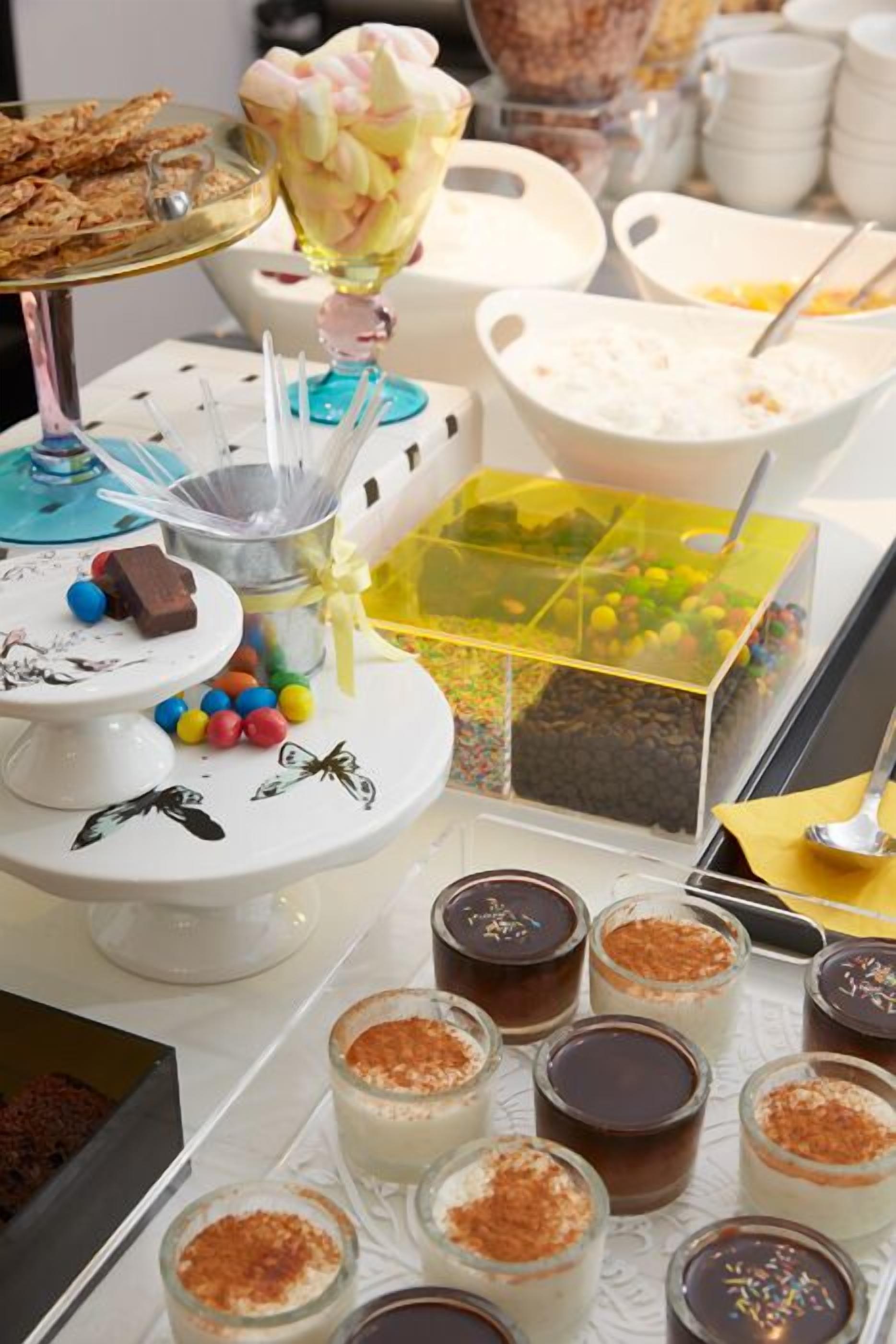 A dessert buffet with various sweets and treats.