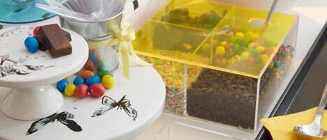 A dessert buffet with various sweets and treats.