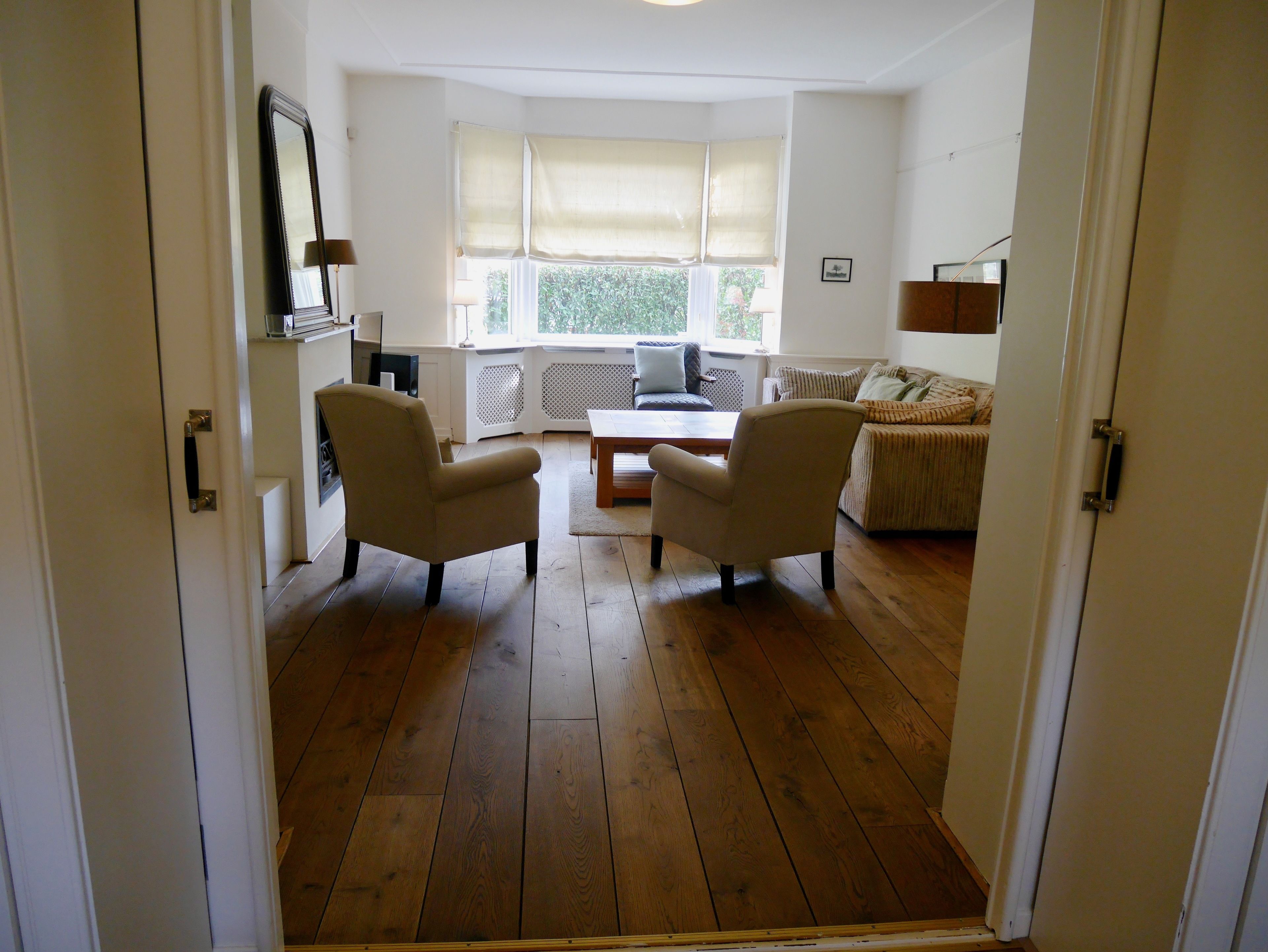 Appartement, 3 slaapkamers (Roelofsstraat 112) | Woonruimte | Een flatscreentelevisie