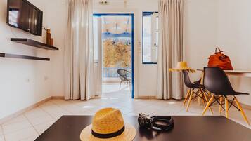 Comfort Apartment | Living area | Flat-screen TV