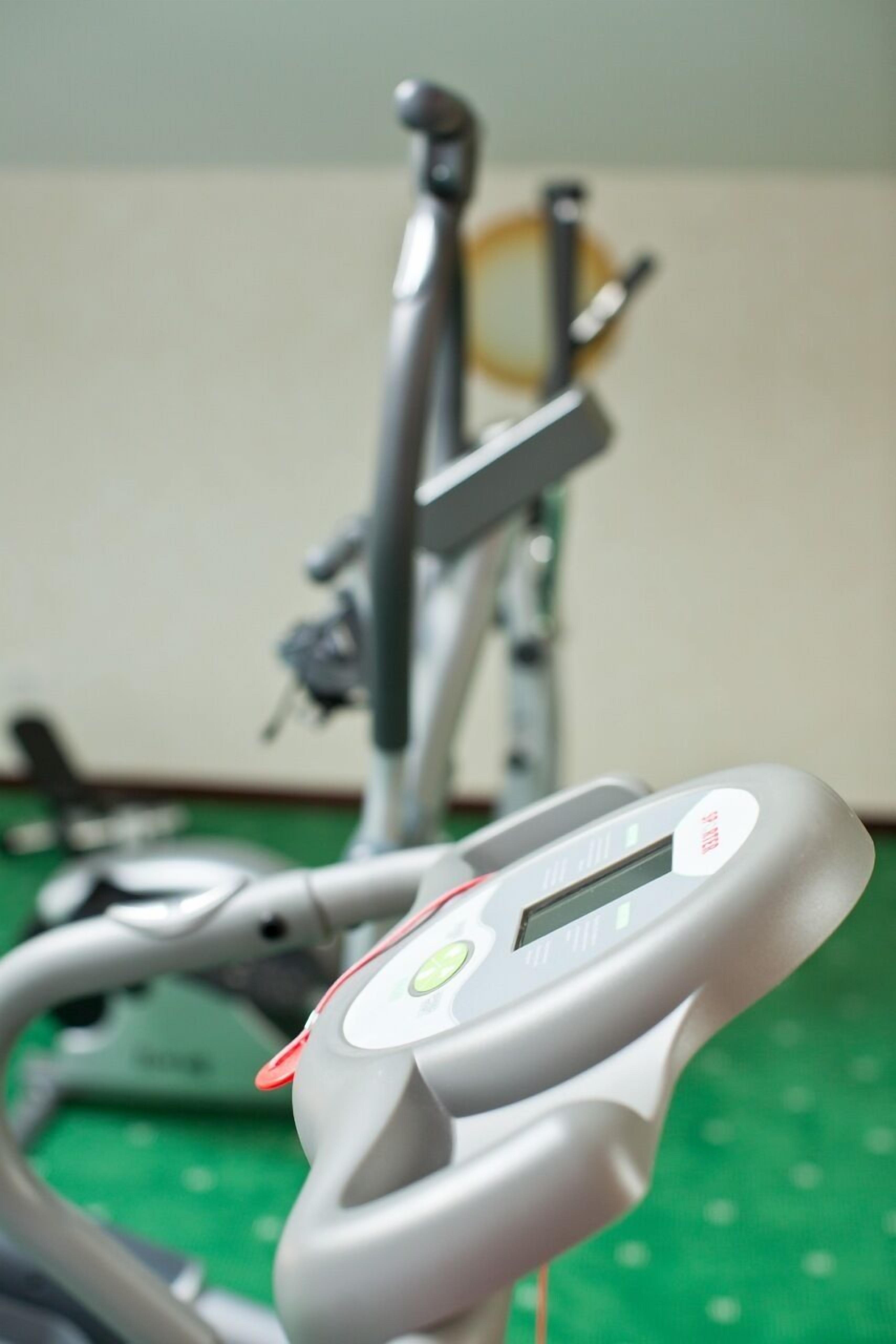 A stationary bike with a digital display and a control panel.