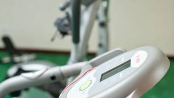 A stationary bike with a digital display and a control panel.