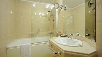 Combined shower/tub, hair dryer, slippers, towels