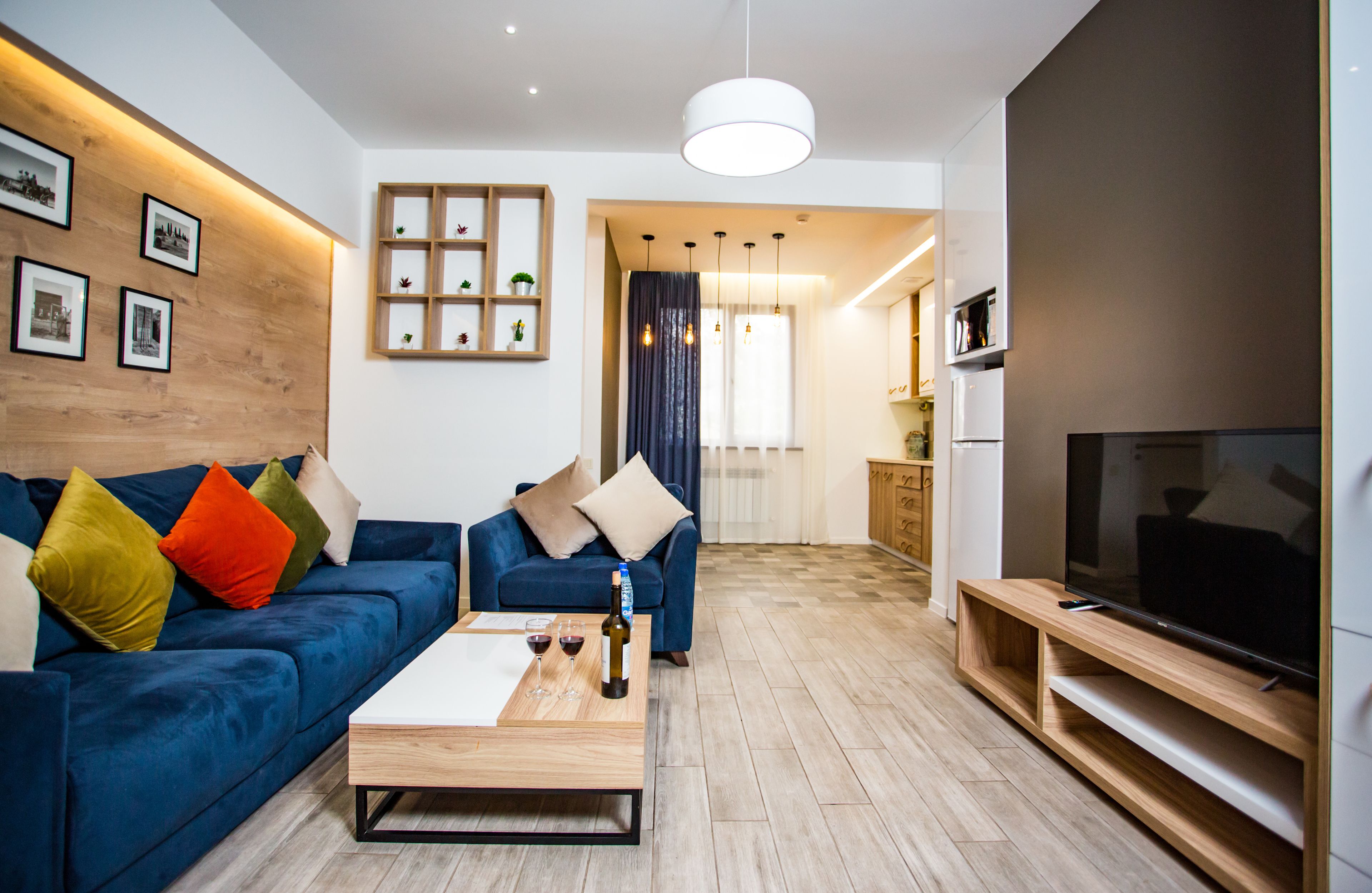 Departamento Deluxe, 2 habitaciones | Sala de estar | Televisión de pantalla plana 