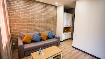 Deluxe Suite | Living room | Flat-screen TV