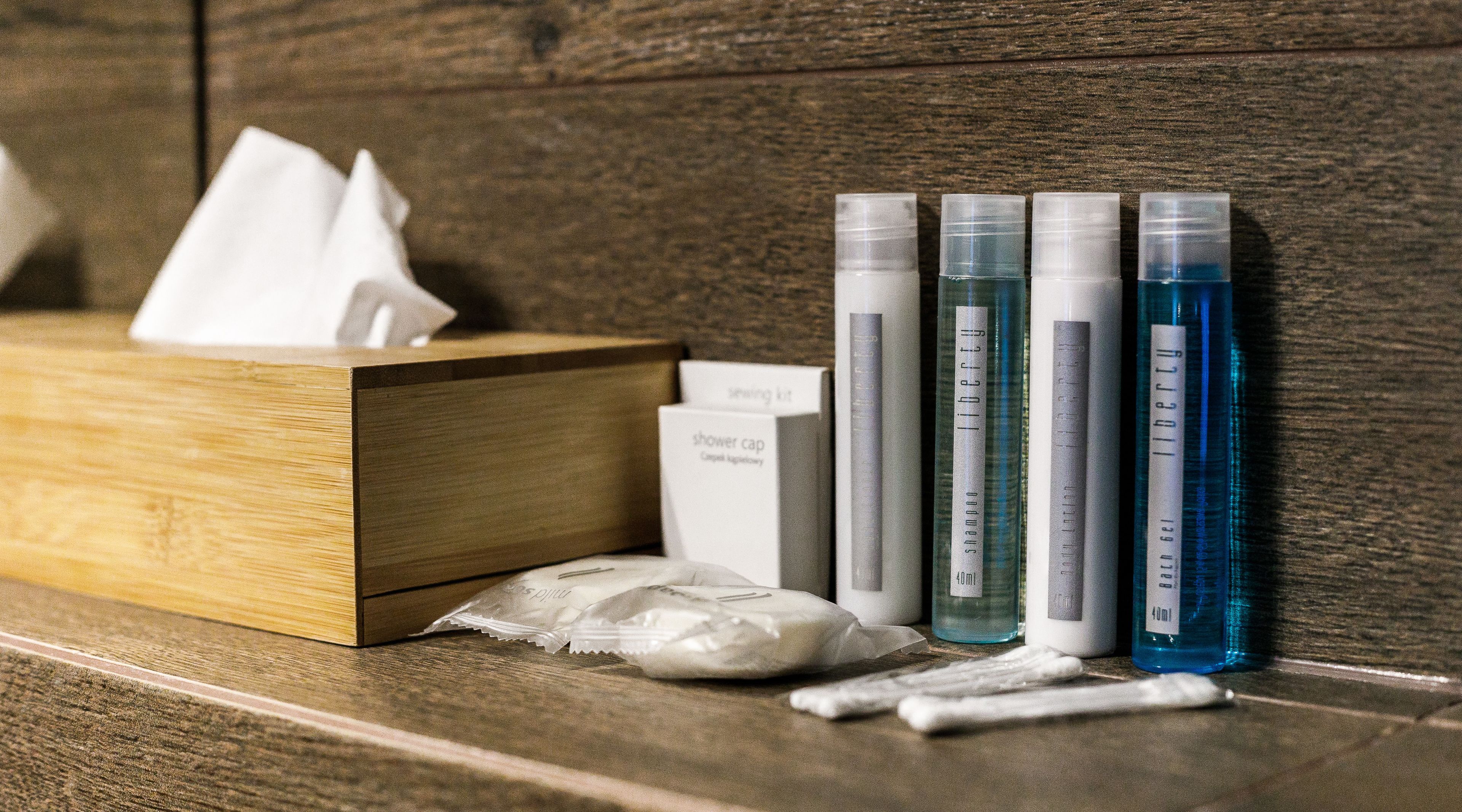 shower, designer toiletries, hair dryer, towels