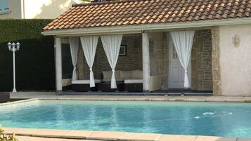 Outdoor pool, open 10:00 AM to 8:30 PM, pool loungers