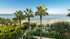 A resort with a beach view, palm trees, and outdoor seating areas. - Melas Resort Hotel (Manavgat)