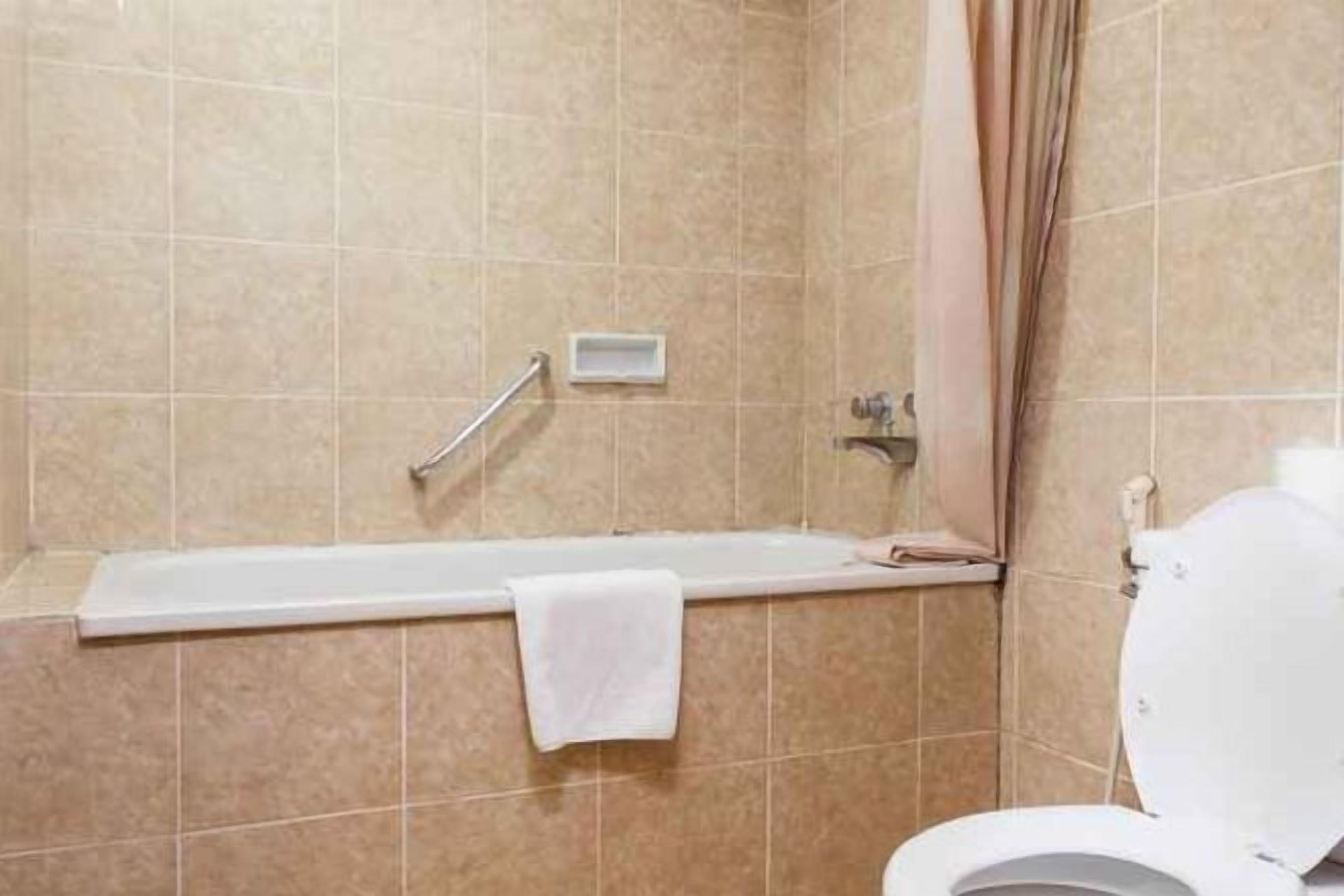 Shower, free toiletries, slippers, towels