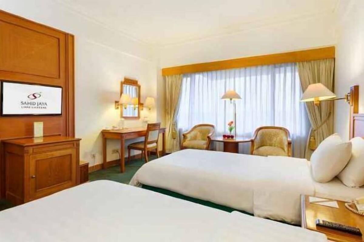 1 quarto, roupas de cama premium, frigobar (abastecido com itens grátis)