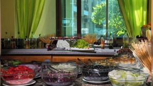 A buffet with various food items and condiments. - Prestige City 2 (Primorsko)